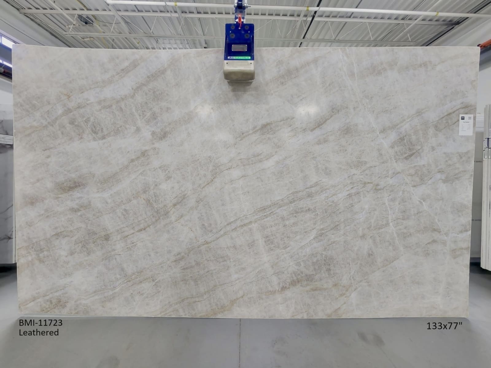 Luxurious Taj Mahal slab with unique natural patterns and a leathered surface.