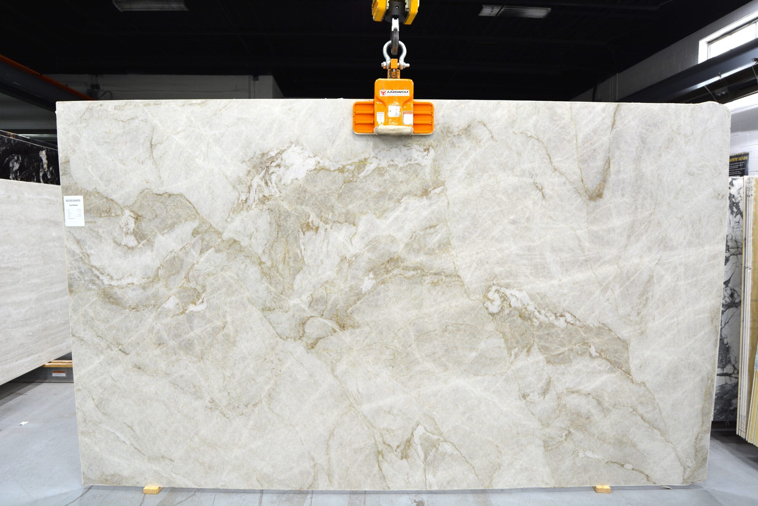 Premium Taj Mahal stone slab featuring soft beige hues and intricate veining.